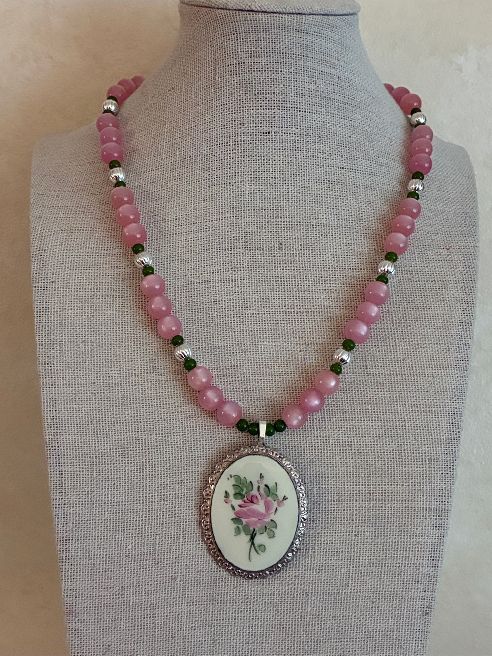 Vintage hand painted rose cameo hung on pink beaded 16” necklace